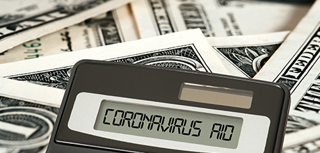 money and calculator that reads "coronavirus aid"