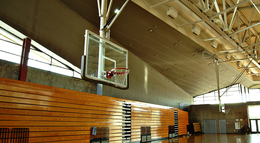 basketball hoop hangs in a school gymnasium
