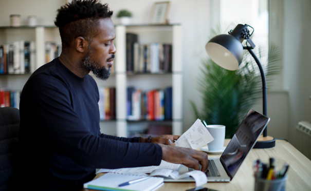 Man calculating budget and finances