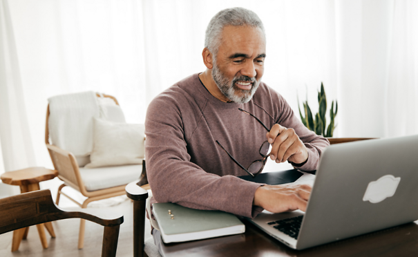 Person reviewing documents on computer