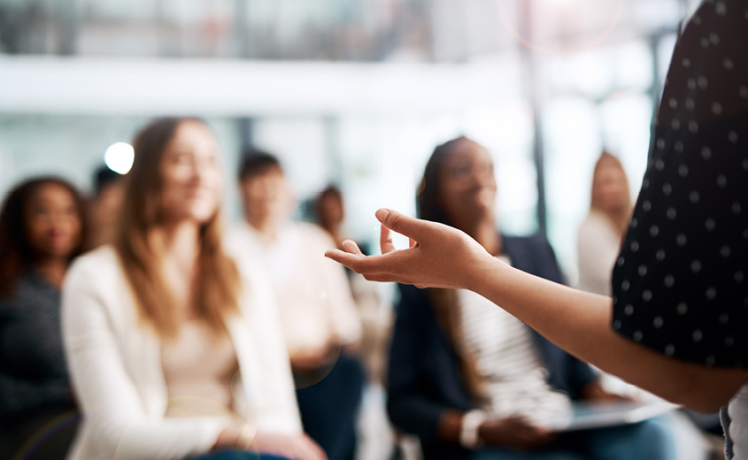 Person presenting to a crowd