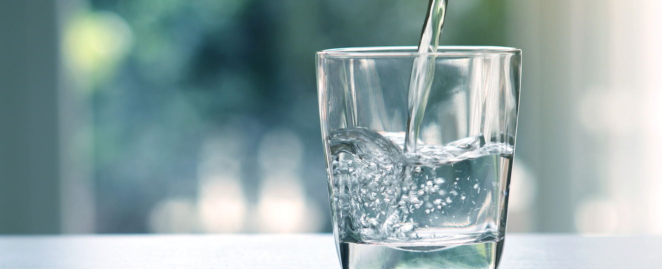 Water being poured into a cup.