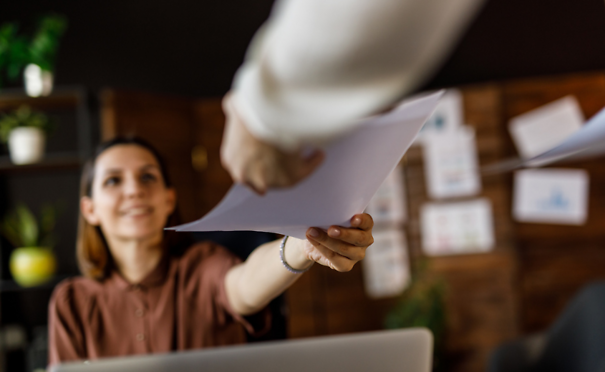 Person handing in paperwork