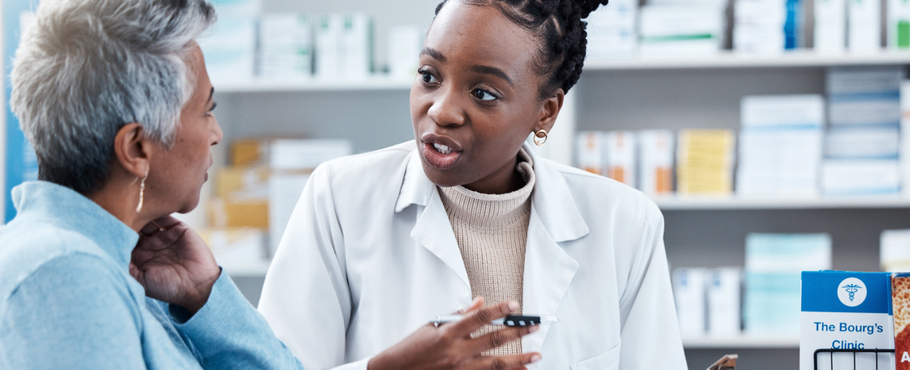 Pharmacy counter with two people talking