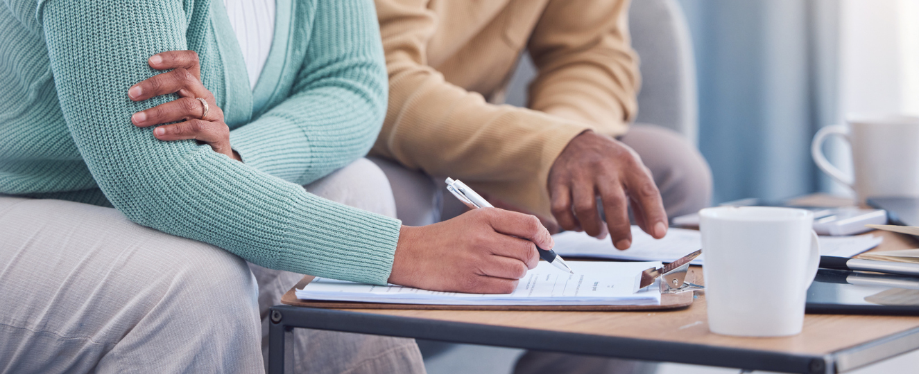 Couple looking over paperwork together.