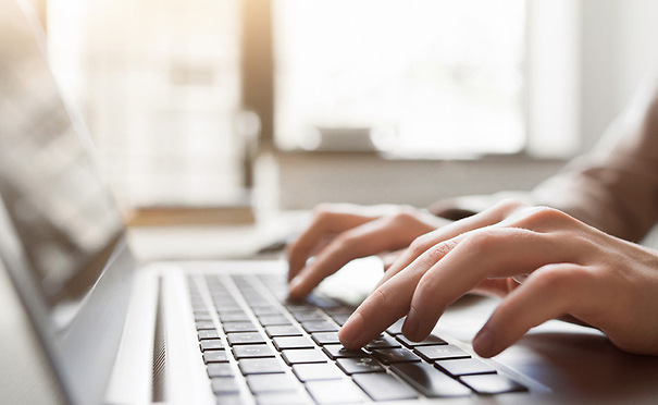 Person typing on a computer