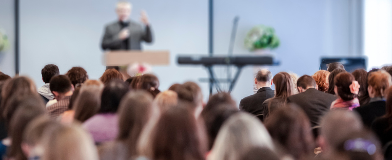 Lecturer Speaking In Front of the Group of People