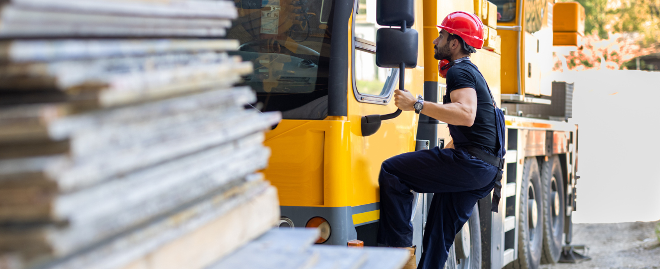 Person climbing into work truck